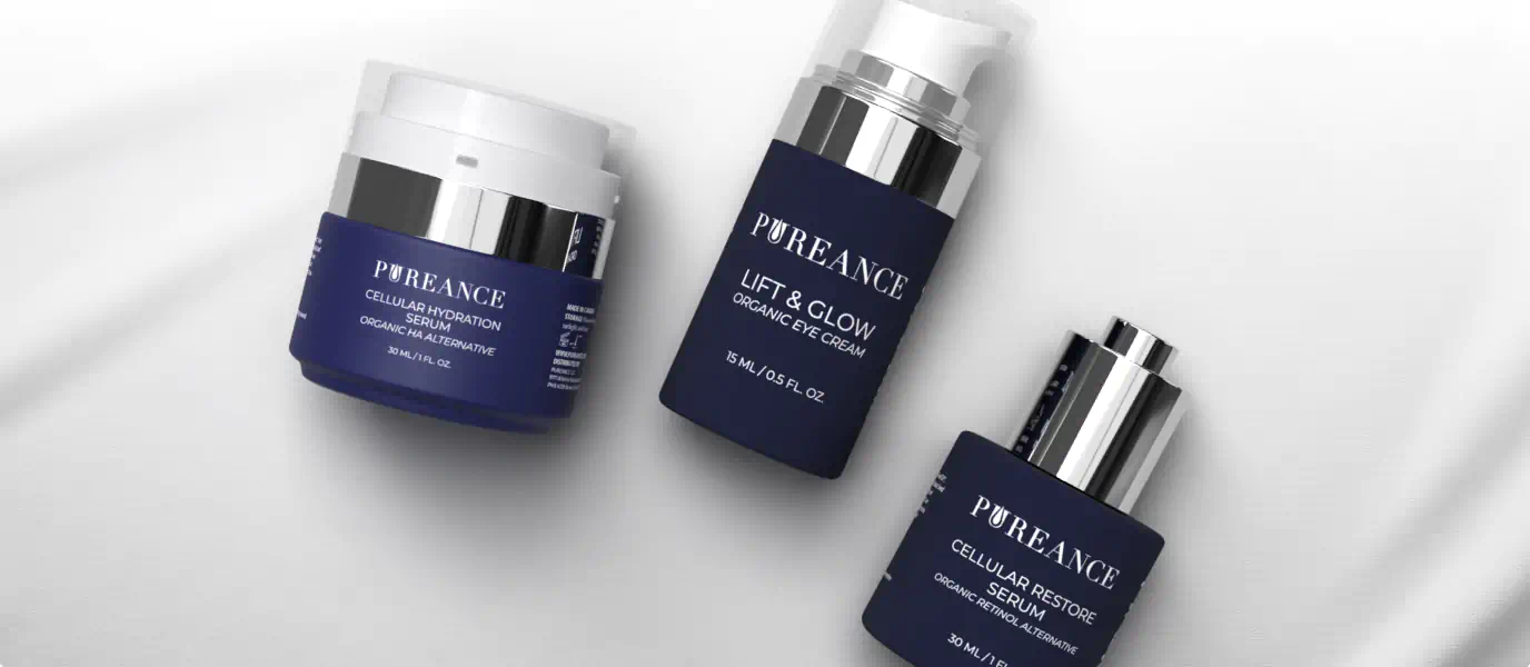 Three Pureance skincare products displayed on a soft white fabric background