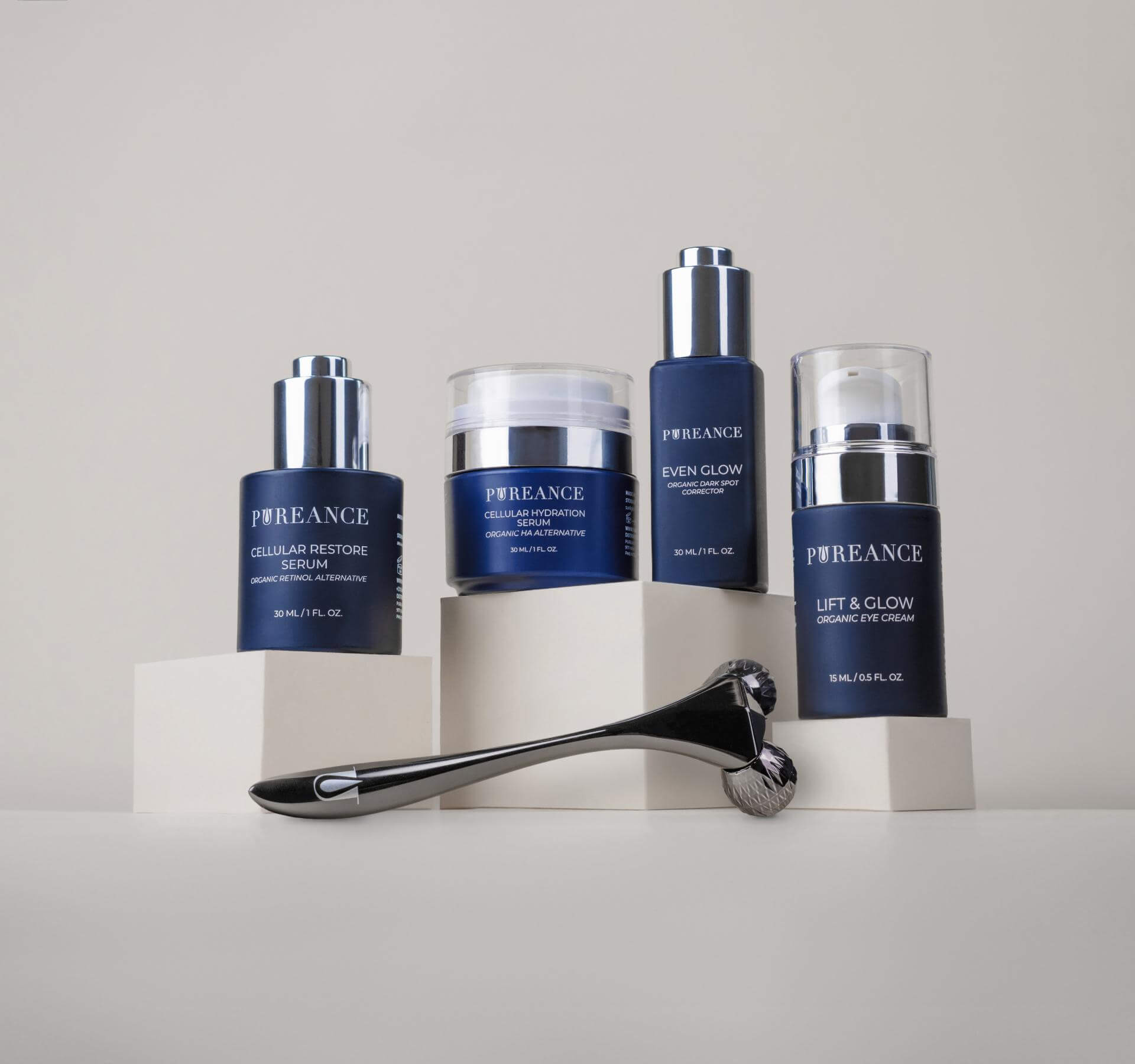 Four Pureance skincare products on podiums with a roller displayed