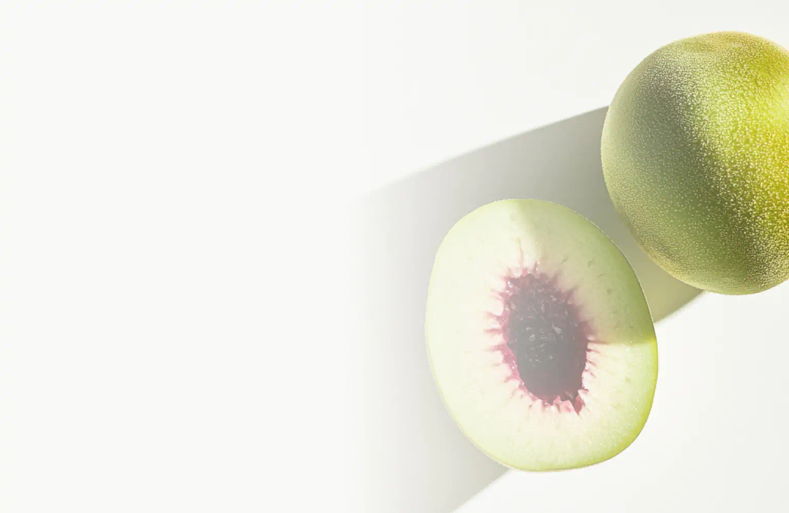 A whole and halved Kakadu plum fruit