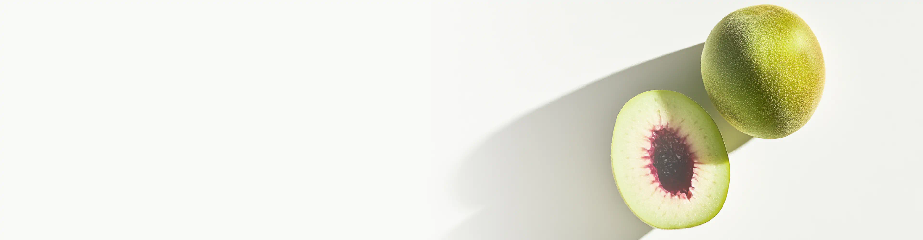 A whole and halved Kakadu plum fruit