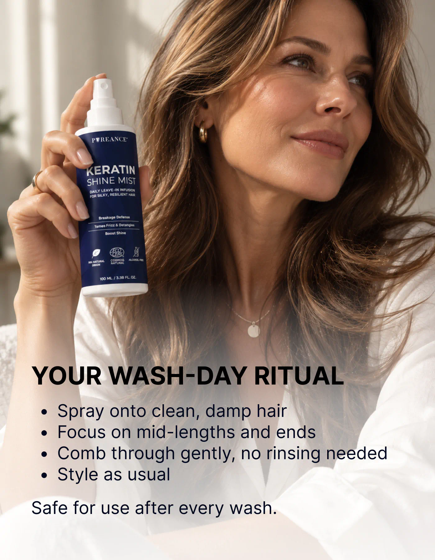 Woman holding Pureance keratin hair spray in wash-day ritual