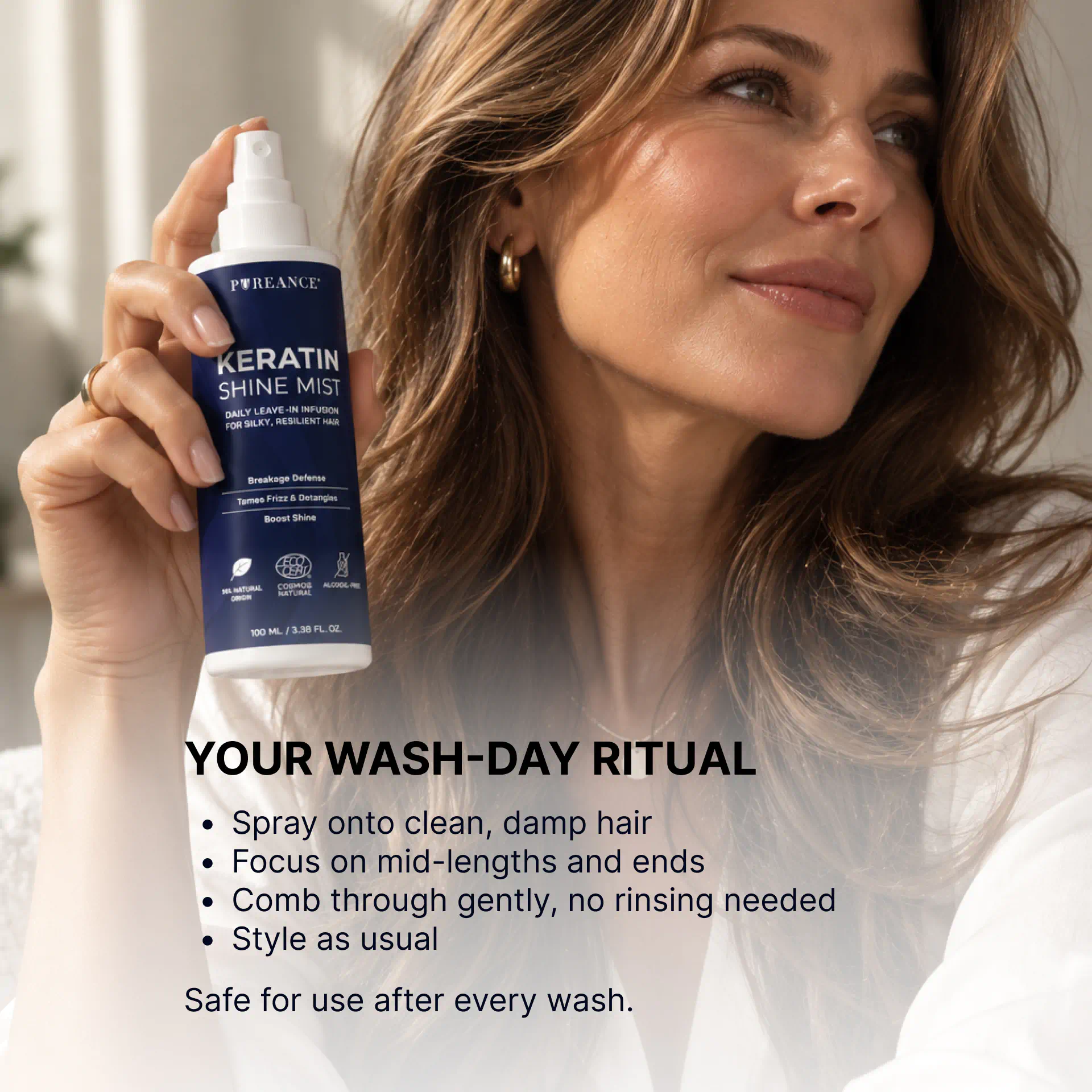 Woman holding Pureance keratin hair spray in wash-day ritual