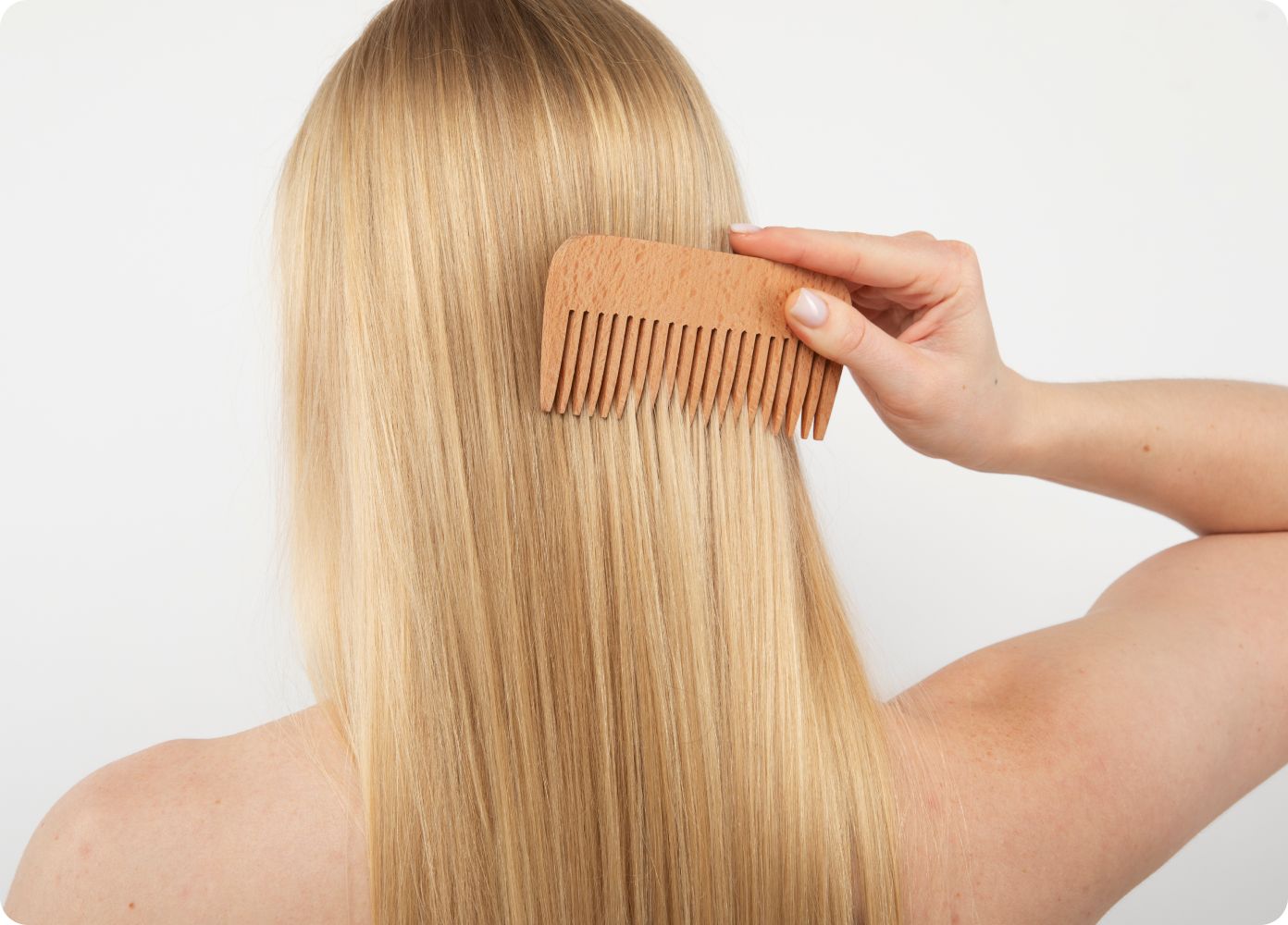 woman brushing her hair